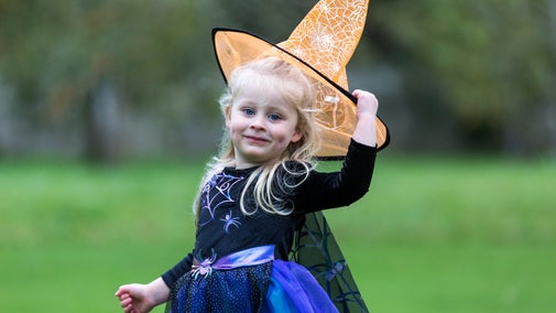 Little girl dressed as a witch at Halloween